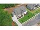 Luxury home with gray roof, landscaped lawn, and large driveway at 5693 Brendlynn Dr, Suwanee, GA 30024