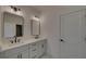 Double vanity bathroom with contemporary mirrors at 5693 Brendlynn Dr, Suwanee, GA 30024