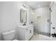 Modern bathroom with a white vanity and glass shower at 5693 Brendlynn Dr, Suwanee, GA 30024