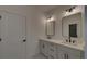 Double vanity bathroom with contemporary mirrors at 5693 Brendlynn Dr, Suwanee, GA 30024