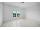Bright bedroom with large window offering a treetop view at 5693 Brendlynn Dr, Suwanee, GA 30024