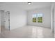 Bright bedroom with large window and closet at 5693 Brendlynn Dr, Suwanee, GA 30024