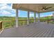 Spacious deck with a view of the wooded area, ceiling fan, and railings at 5693 Brendlynn Dr, Suwanee, GA 30024