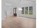 Open dining room with hardwood floors and a modern chandelier at 5693 Brendlynn Dr, Suwanee, GA 30024