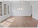 Bright dining room with hardwood floors and large windows at 5693 Brendlynn Dr, Suwanee, GA 30024