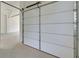 Garage with automatic door opener at 5693 Brendlynn Dr, Suwanee, GA 30024
