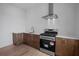 Small kitchen with modern appliances and light wood cabinets at 5693 Brendlynn Dr, Suwanee, GA 30024