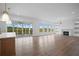 Spacious living area with hardwood floors, fireplace and access to deck at 5693 Brendlynn Dr, Suwanee, GA 30024