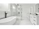 This bathroom features a soaking tub, walk-in shower, and double vanity at 2861 Tree Top Rd, Dacula, GA 30019