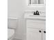 This bathroom features a white vanity and a white toilet at 2861 Tree Top Rd, Dacula, GA 30019