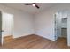 Bedroom boasting a ceiling fan, light colored wood floors and an open closet at 2861 Tree Top Rd, Dacula, GA 30019