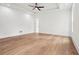 Spacious bedroom with hardwood floors, ceiling fan, recessed lighting, and tray ceiling at 2861 Tree Top Rd, Dacula, GA 30019