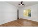 The bedroom includes wood floors, closet, one window and crisp, white walls at 2861 Tree Top Rd, Dacula, GA 30019
