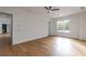 This bedroom features light colored wood floors and a view into another room at 2861 Tree Top Rd, Dacula, GA 30019