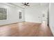 Bright, airy bedroom with hardwood floors, tray ceiling, recessed lighting, and large windows at 2861 Tree Top Rd, Dacula, GA 30019