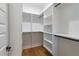 Walk-in closet featuring custom shelving and organization systems at 2861 Tree Top Rd, Dacula, GA 30019