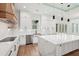 Modern kitchen features white cabinets, marble countertops, a large island, and stainless steel appliances at 2861 Tree Top Rd, Dacula, GA 30019