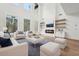 Bright living room with high ceilings, fireplace, large windows and elegant decor at 2861 Tree Top Rd, Dacula, GA 30019