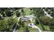 Aerial view of home surrounded by 2.75 acres of property boundary lines. Rolling green hills and lush tree coverage at 3898 Ridge Rd, Buford, GA 30519