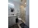 Modern bathroom with glass shower door and white vanity at 3898 Ridge Rd, Buford, GA 30519