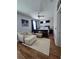 Comfortable bedroom with a ceiling fan, a plush armchair, and hardwood floors enhancing its appeal at 3898 Ridge Rd, Buford, GA 30519