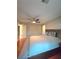 Bright bedroom featuring a ceiling fan and hardwood floors throughout the home at 3898 Ridge Rd, Buford, GA 30519