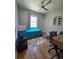 Bright bedroom features a cozy bed, ceiling fan, and modern decor at 3898 Ridge Rd, Buford, GA 30519