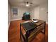 Bedroom featuring an organized workstation and hardwood floors throughout the room at 3898 Ridge Rd, Buford, GA 30519