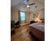Cozy bedroom with a vaulted ceiling, hardwood flooring, and ample natural light at 3898 Ridge Rd, Buford, GA 30519