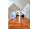 Open bonus room featuring hardwood floors, natural light, and extra space for versatile living at 3898 Ridge Rd, Buford, GA 30519