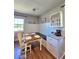 Charming dining area with a rustic table and natural light at 3898 Ridge Rd, Buford, GA 30519