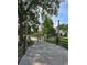 Long paved driveway leads to a charming home with mature trees and beautiful countryside views at 3898 Ridge Rd, Buford, GA 30519