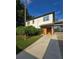 Charming home with a modern exterior, featuring a well-kept lawn and covered carport at 3898 Ridge Rd, Buford, GA 30519