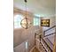 Foyer with chandelier lighting, stairs, and art on the wall at 3898 Ridge Rd, Buford, GA 30519