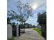 Beautiful property featuring a gated entrance with a circular drive leading to the main house and lush green lawns at 3898 Ridge Rd, Buford, GA 30519