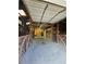 Bright and airy horse barn with sturdy wooden stalls and a well-maintained concrete floor at 3898 Ridge Rd, Buford, GA 30519