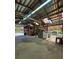 Functional horse barn interior equipped with washing machine, laundry sink, storage rack, and other supplies at 3898 Ridge Rd, Buford, GA 30519