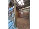 Clean horse stall with a ceiling fan and wooden paneling and wood chip ground cover for comfort and relaxation at 3898 Ridge Rd, Buford, GA 30519