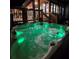 Glowing hot tub at night, illuminated with vibrant green lights for a fun evening at 3898 Ridge Rd, Buford, GA 30519