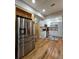 Modern kitchen with stainless steel appliances and ample cabinet space, open to the living area at 3898 Ridge Rd, Buford, GA 30519