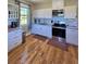 Bright kitchen featuring modern appliances and ample counter space at 3898 Ridge Rd, Buford, GA 30519