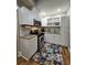Well-equipped kitchen featuring stainless steel appliances and white cabinetry at 3898 Ridge Rd, Buford, GA 30519