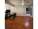 Inviting living room featuring beautiful hardwood floors with access to the outdoor deck at 3898 Ridge Rd, Buford, GA 30519
