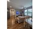 Open living area with hardwood floors, couch, and dining set at 3898 Ridge Rd, Buford, GA 30519