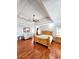 Spacious main bedroom featuring a tray ceiling, ceiling fan, and hardwood floors at 3898 Ridge Rd, Buford, GA 30519