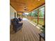 Inviting covered patio with wood ceiling, ceiling fan, and an open view at 3898 Ridge Rd, Buford, GA 30519