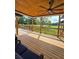 Covered patio with wood ceiling, ceiling fan, and view of fenced-in yard at 3898 Ridge Rd, Buford, GA 30519