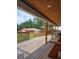 Covered patio with wood ceiling, ceiling fan, and a view of the backyard and barn at 3898 Ridge Rd, Buford, GA 30519