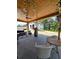 Cozy outdoor space with wicker furniture, a barrel table and views of the neighborhood at 3898 Ridge Rd, Buford, GA 30519