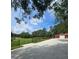 Expansive property featuring a driveway leading to a barn and tree-lined field at 3898 Ridge Rd, Buford, GA 30519